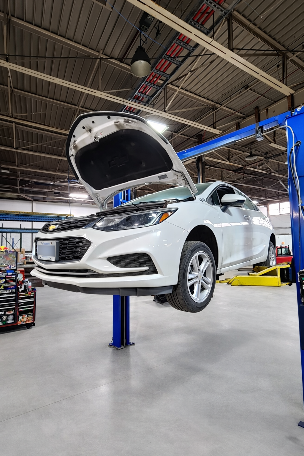 Technician performing light-duty vehicle service